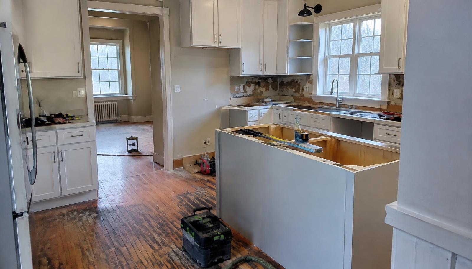 Illustrative photo: a kitchen renovation in progress in an older home