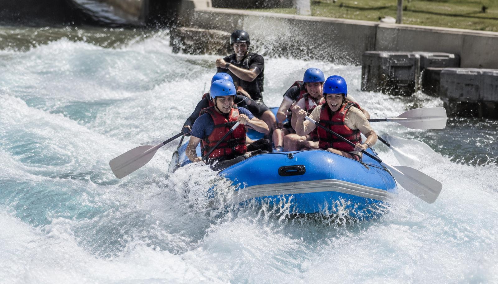 Illustrative photo: rafters paddling through man-made whitewater rapids
